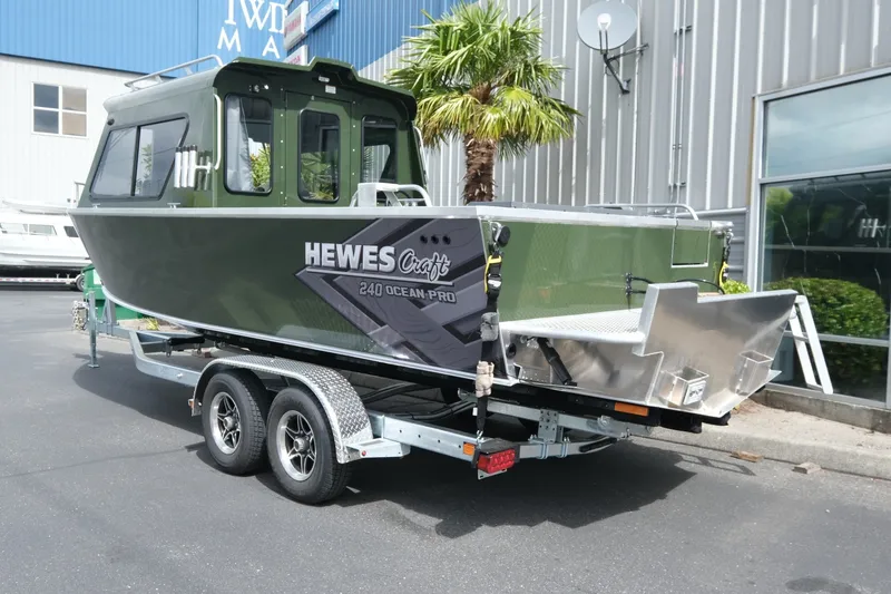 Slide: The Image of 2026 Hewescraft 240 Ocean Pro ET Hardtop boat on trailer, parked outdoors. - 4