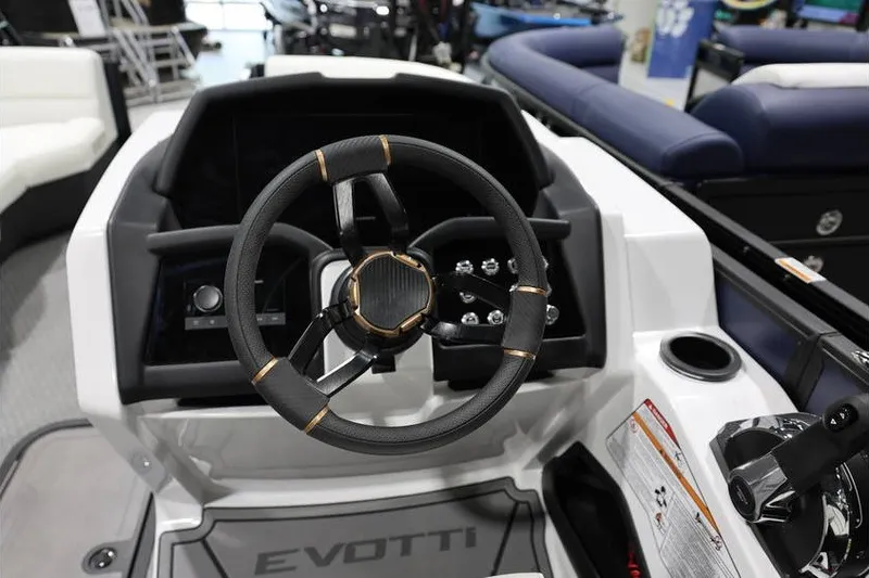 Slide: The Image of Steering wheel of 2026 Evotti 723QL boat, featuring modern dashboard controls. - 18