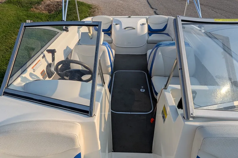 Slide: The Image of 2007 Bayliner 175 Bowrider interior with seating, steering wheel, and windshield. - 22
