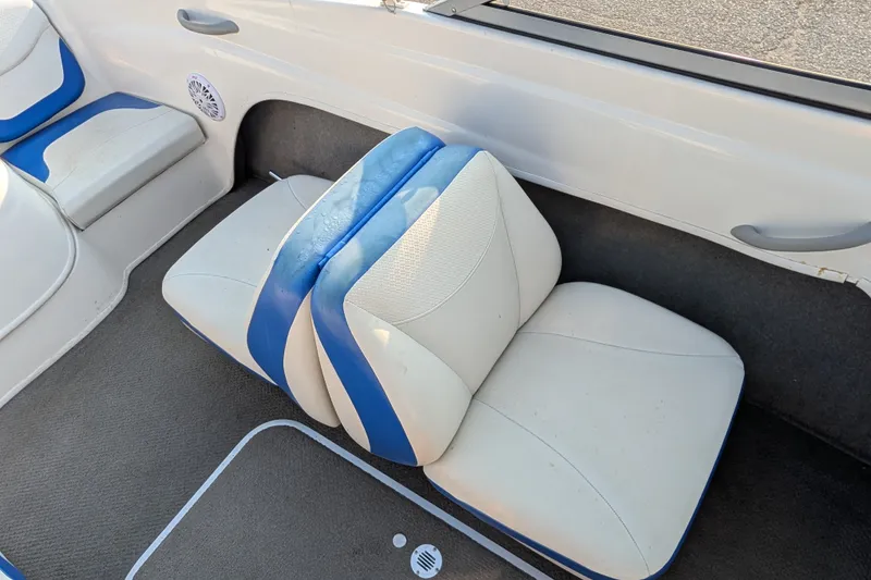 Slide: The Image of 2007 Bayliner 175 Bowrider interior seating with blue and white upholstery. - 20