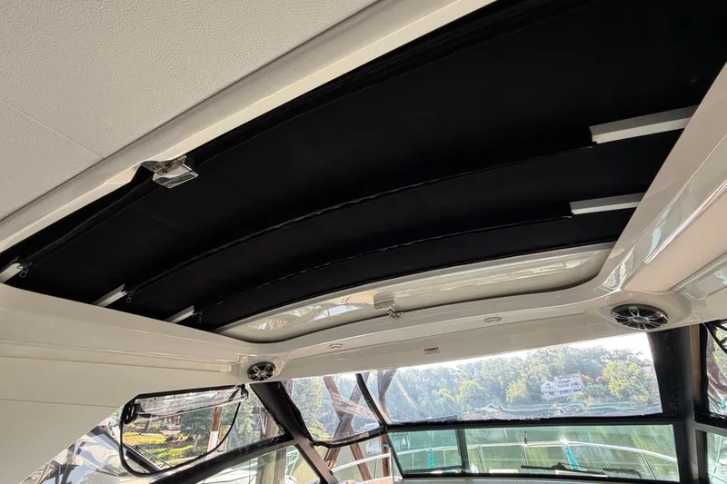 Slide: The Image of 2020 Sea Ray Sundancer 320 boat interior with sunroof and scenic view. - 24
