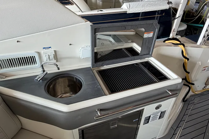 Slide: The Image of Outdoor kitchenette on 2020 Sea Ray Sundancer 320 yacht with sink and grill. - 9
