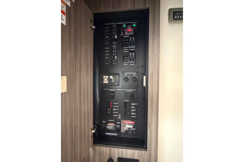 Slide: The Image of Electrical control panel inside 2020 Sea Ray Sundancer 320 yacht. - 25