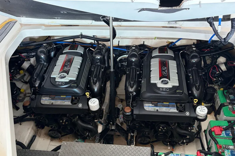 Slide: The Image of Twin engines in a 2020 Sea Ray Sundancer 320 boat engine compartment. - 11