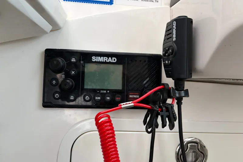 Slide: The Image of Simrad marine radio system on 2020 Sea Ray Sundancer 320 boat dashboard. - 22