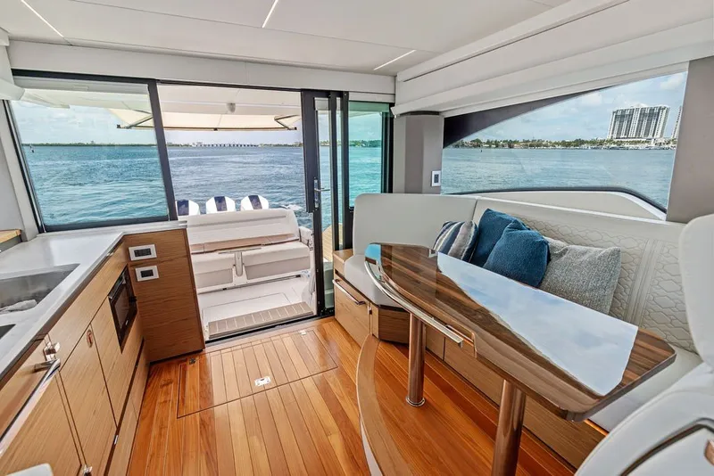 Slide: The Image of Luxurious interior of 2024 Tiara 48 LE yacht with elegant seating and ocean view. - 35