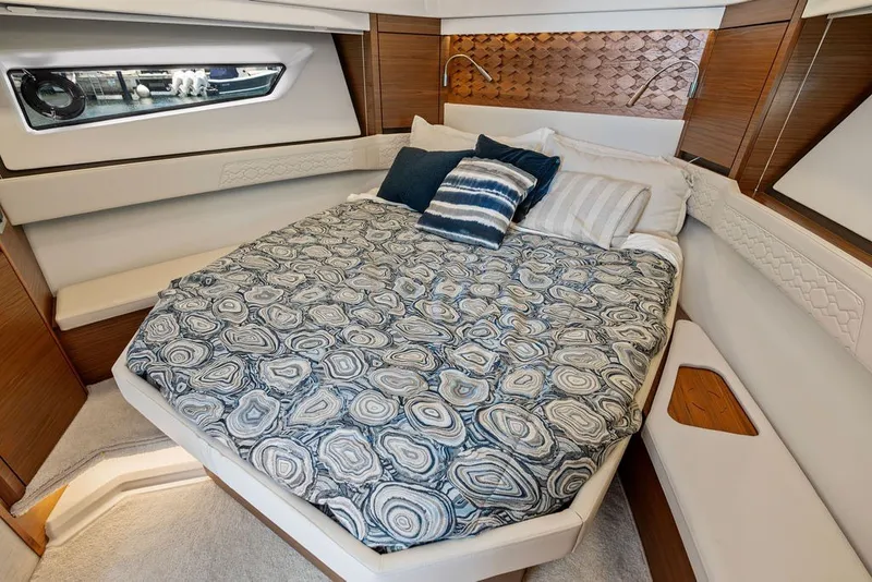 Slide: The Image of Luxurious cabin interior of 2024 Tiara 48 LE yacht with stylish bedding and modern design. - 49
