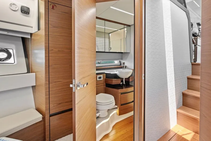 Slide: The Image of Luxurious 2024 Tiara 48 LE yacht interior with modern bathroom and wooden finishes. - 51