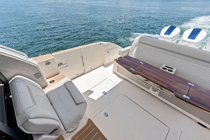 Slide: The Image of Luxurious seating area on 2024 Tiara 48 LE yacht with ocean view. - 26