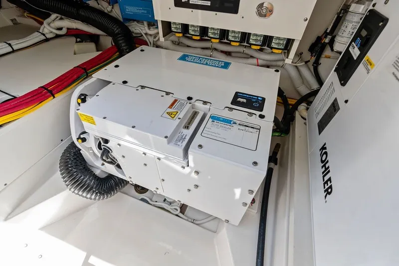 Slide: The Image of Engine room of 2024 Tiara 48 LE yacht with Kohler generator and wiring. - 64