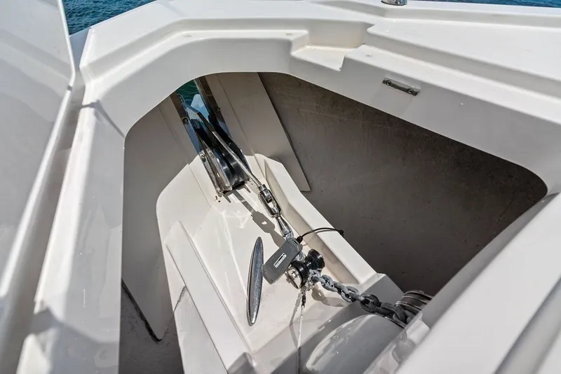 Slide: The Image of Anchor compartment of 2024 Tiara 48 LE yacht, showcasing chain and mechanism. - 18