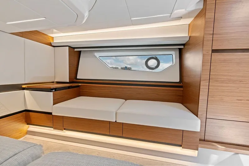 Slide: The Image of Luxurious interior of 2024 Tiara 48 LE yacht with modern wood and white accents. - 58