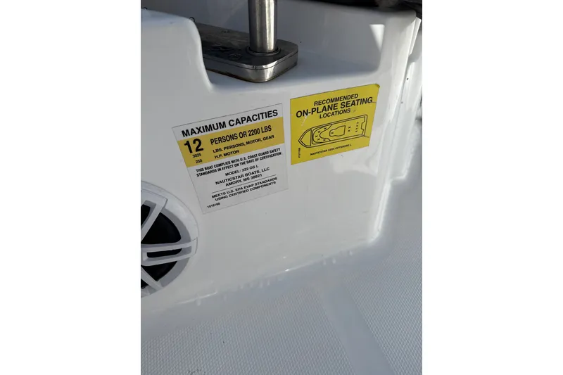 Slide: The Image of 2024 NauticStar 222L Offshore capacity label, showing 12-person or 2200 lbs limit. - 8