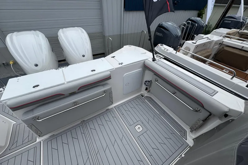 Slide: The Image of 2026 Solara S-310 CW boat deck with seating and twin outboard engines. - 12