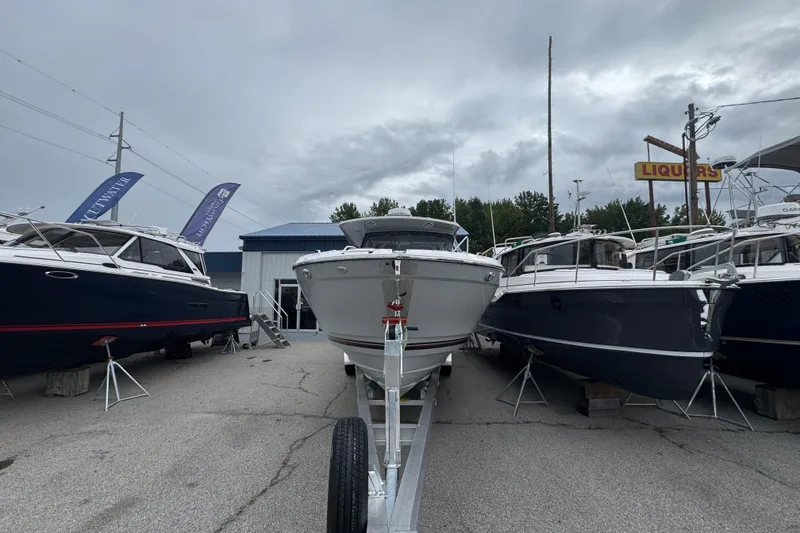 Slide: The Image of 2026 Solara S-310 CW boat displayed outdoors among other boats. - 4