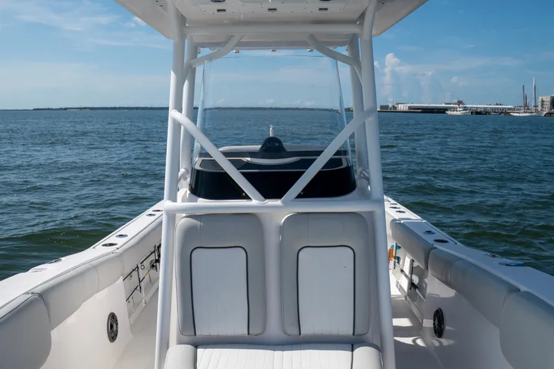 Slide: The Image of 2022 Sea Fox 248 Commander boat on open water, showcasing helm and seating area. - 9