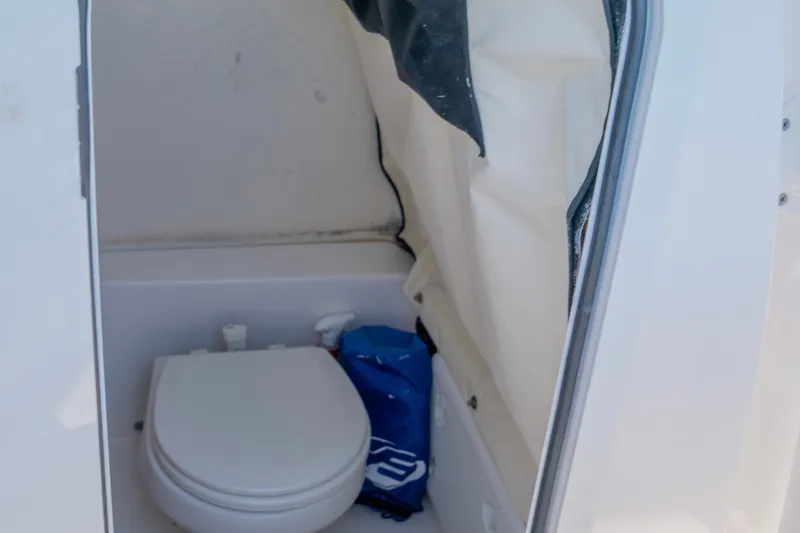 Slide: The Image of Interior view of 2022 Sea Fox 248 Commander boat's compact bathroom area. - 13