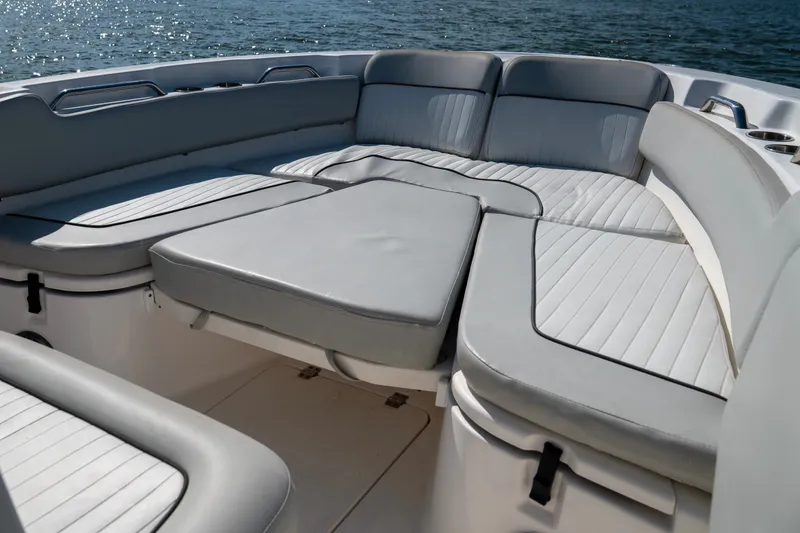 Slide: The Image of 2022 Sea Fox 248 Commander boat interior with cushioned seating and ocean view. - 7