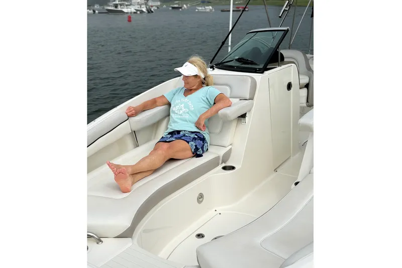 Slide: The Image of Woman relaxing on a 2012 Sea Ray 260 Sundeck boat. - 8
