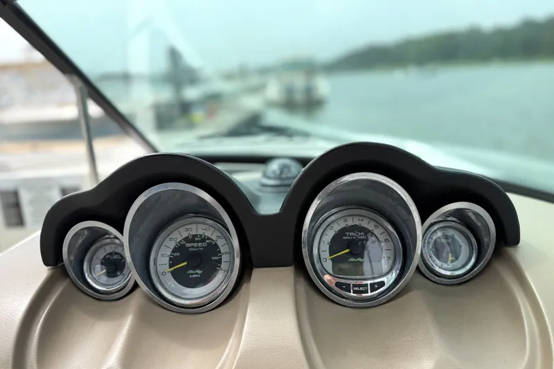 Slide: The Image of Dashboard of a 2012 Sea Ray 260 Sundeck boat with speedometer and tachometer. - 30