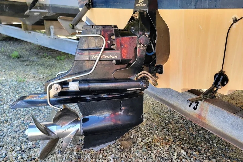 Slide: The Image of Close-up of a 2012 Sea Ray 260 Sundeck boat's MerCruiser outdrive and propeller. - 22