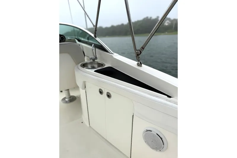 Slide: The Image of Interior view of a 2012 Sea Ray 260 Sundeck boat with sink and storage. - 27