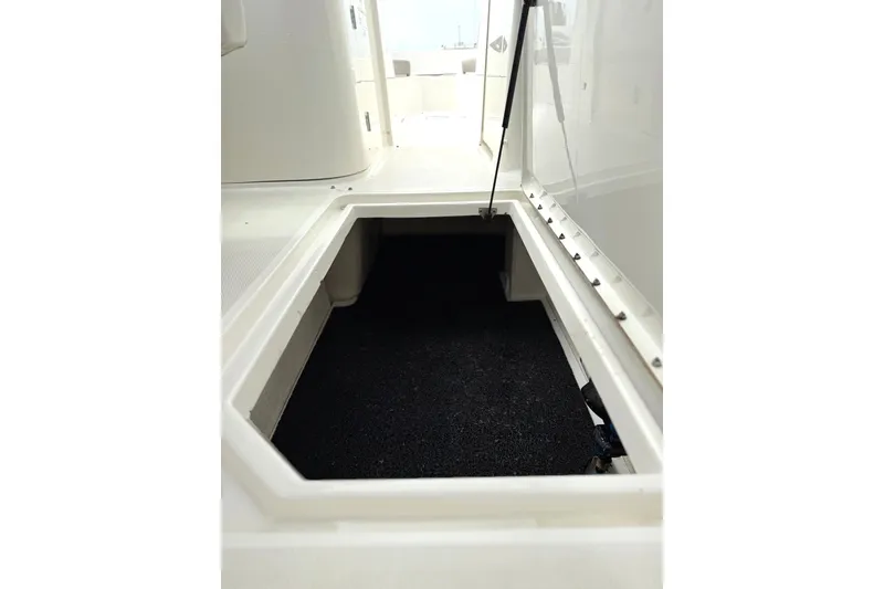 Slide: The Image of Open storage compartment on a 2012 Sea Ray 260 Sundeck boat. - 14