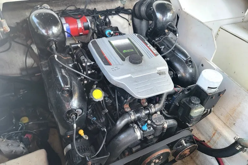 Slide: The Image of Engine compartment of a 2012 Sea Ray 260 Sundeck boat, showcasing the motor components. - 11