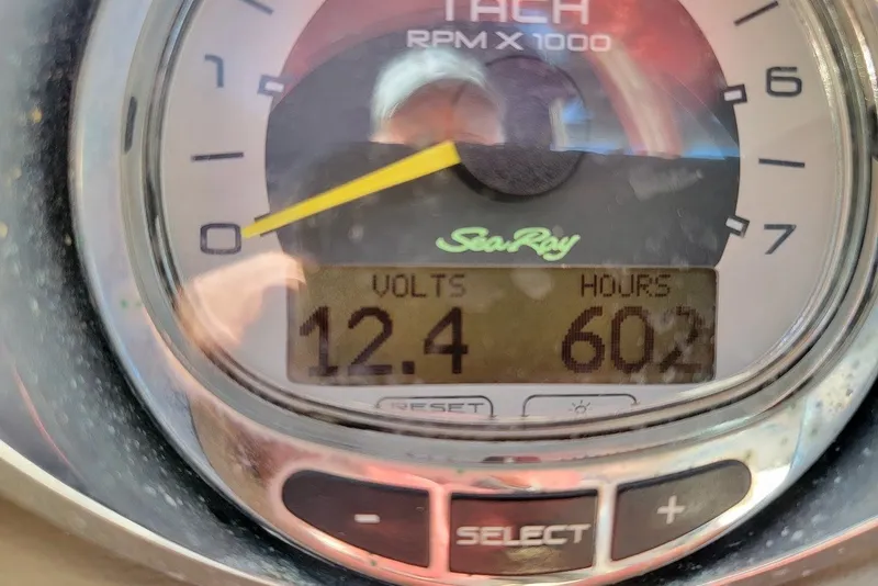 Slide: The Image of Close-up of a 2012 Sea Ray 260 Sundeck tachometer displaying 12.4 volts and 602 hours. - 12
