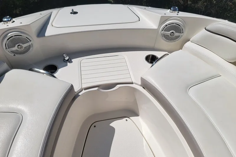 Slide: The Image of 2012 Sea Ray 260 Sundeck interior with seating, speakers, and cup holders. - 5