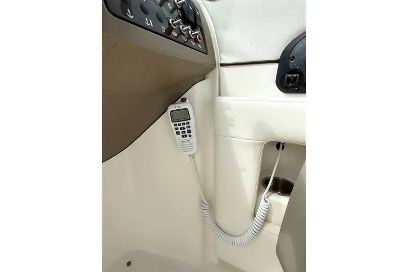 Slide: The Image of Control panel and radio on 2012 Sea Ray 260 Sundeck boat interior. - 34
