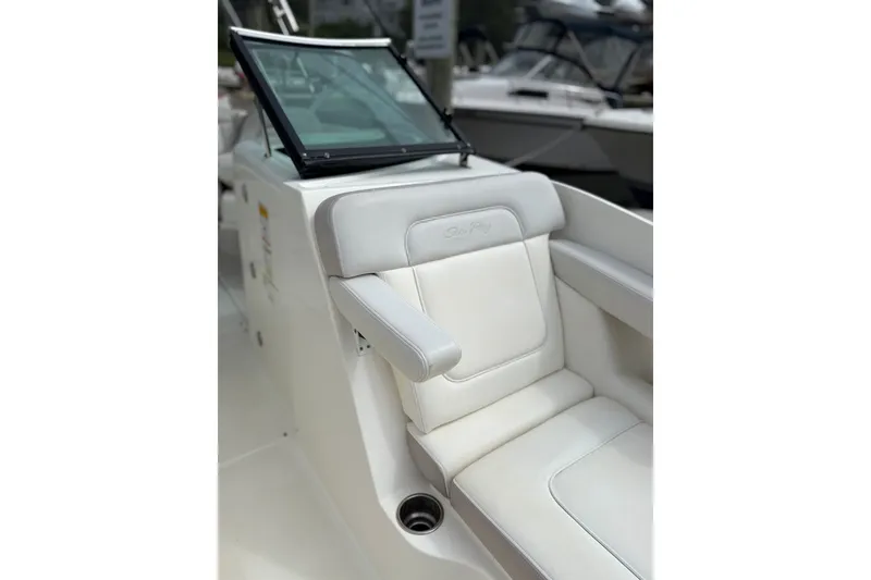 Slide: The Image of 2012 Sea Ray 260 Sundeck boat interior with white seating and windshield. - 39