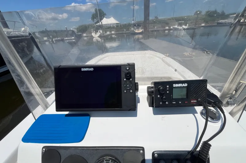 Slide: The Image of 2006 Twin Vee 19 BayCat boat dashboard with Simrad navigation equipment. - 5
