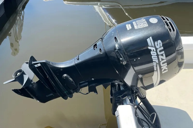 Slide: The Image of Suzuki 115 Four Stroke outboard motor on a 2006 Twin Vee 19 BayCat boat. - 6