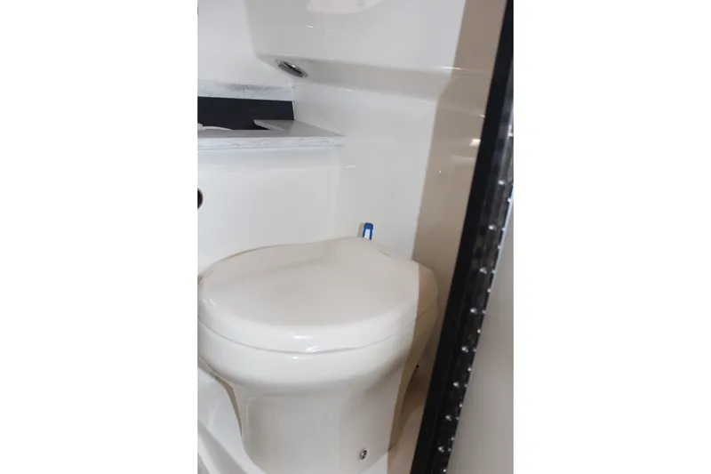 Slide: The Image of 2017 Formula 330 Crossover Bowrider boat bathroom interior with toilet. - 41