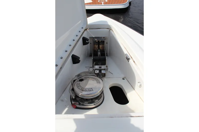 Slide: The Image of 2017 Formula 330 Crossover Bowrider anchor compartment with windlass system. - 49
