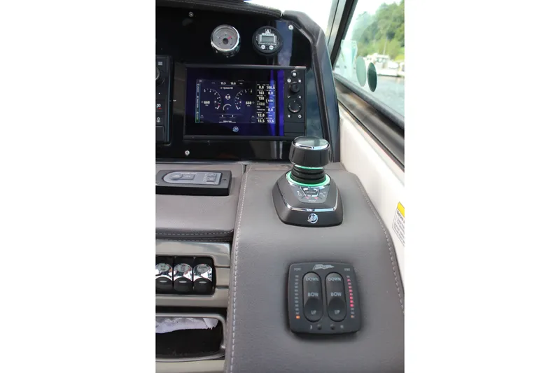 Slide: The Image of Control panel of 2017 Formula 330 Crossover Bowrider with joystick and digital display. - 27