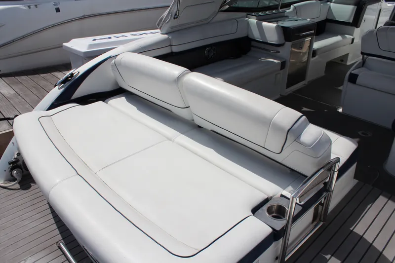 Slide: The Image of 2017 Formula 330 Crossover Bowrider interior with luxurious white seating and modern amenities. - 8