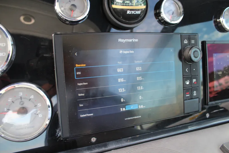 Slide: The Image of Dashboard of 2017 Formula 330 Crossover Bowrider with Raymarine display and gauges. - 25