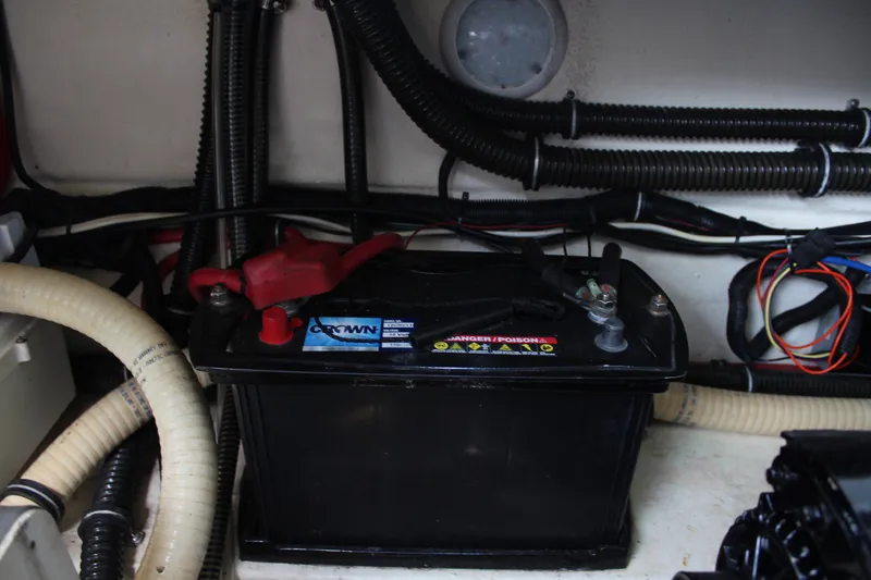 Slide: The Image of Battery compartment of 2017 Formula 330 Crossover Bowrider with cables and wiring. - 31