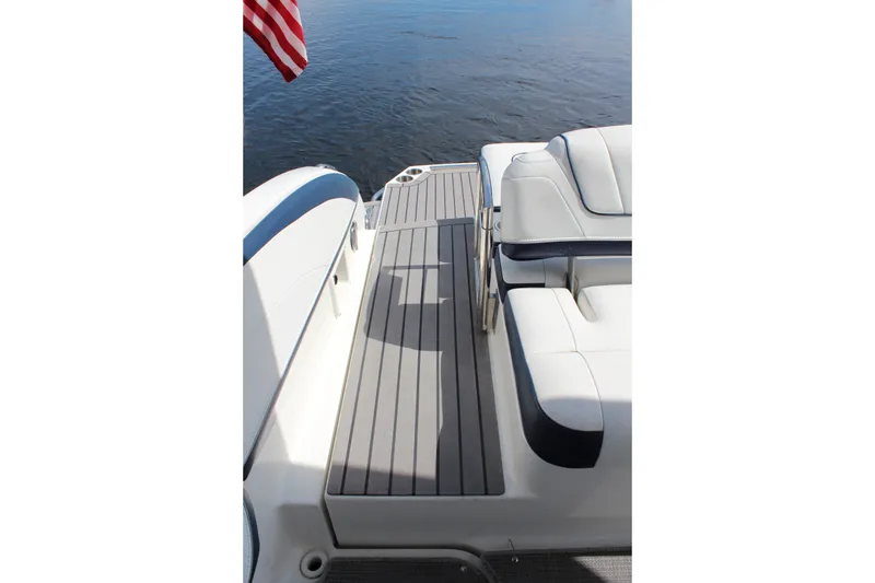 Slide: The Image of 2017 Formula 330 Crossover Bowrider boat deck with seating and water view. - 6