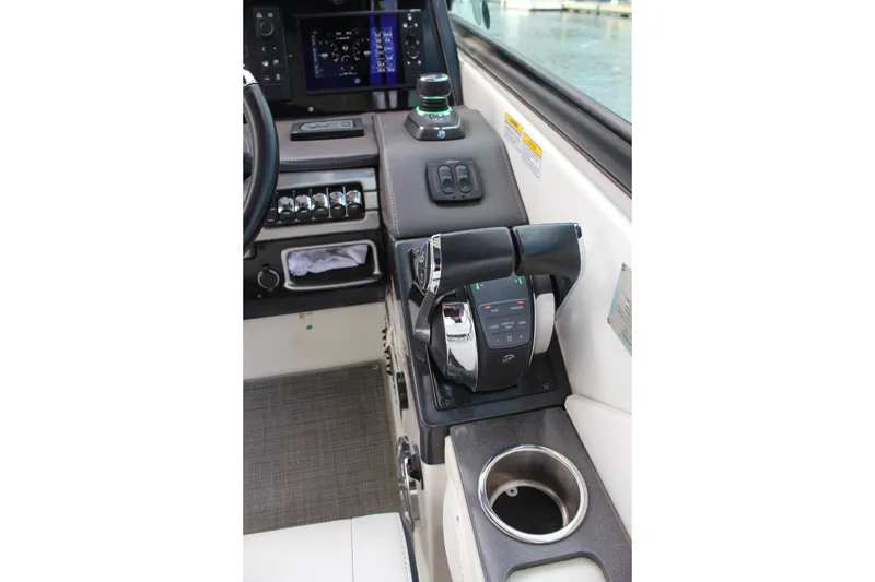 Slide: The Image of 2017 Formula 330 Crossover Bowrider helm with controls and cup holder. - 26