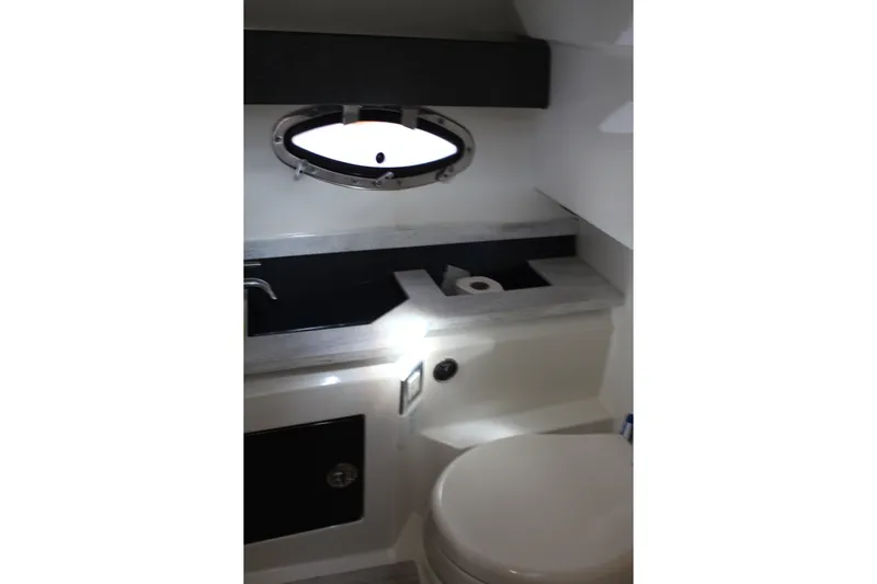 Slide: The Image of 2017 Formula 330 Crossover Bowrider bathroom interior with sink and toilet. - 40