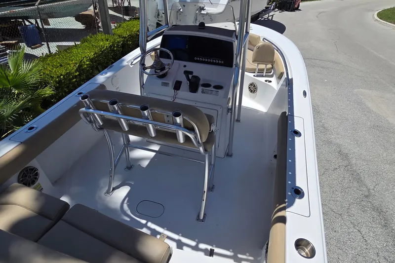 Slide: The Image of 2016 Sportsman Heritage 211 Center Console boat interior with seating and steering console. - 16