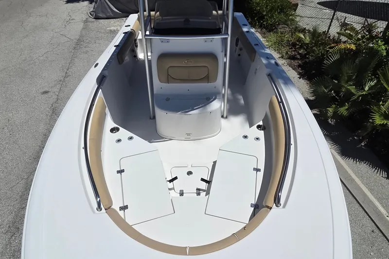 Slide: The Image of 2016 Sportsman Heritage 211 Center Console boat, spacious deck, sleek design, white and tan accents. - 11