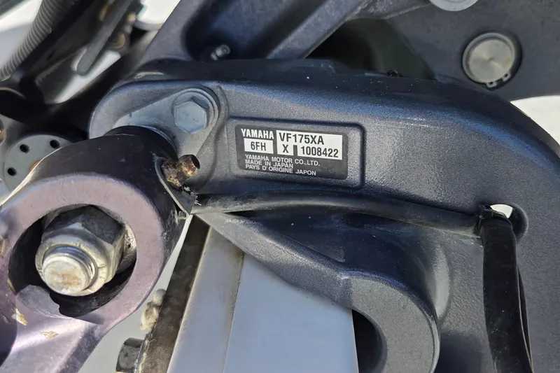 Slide: The Image of Close-up of Yamaha VF175XA engine part on 2016 Sportsman Heritage 211 Center Console boat. - 18