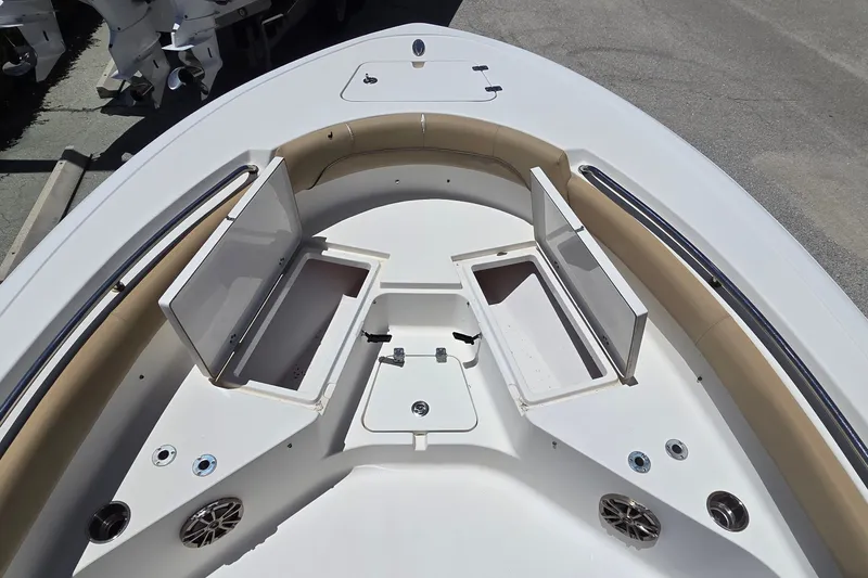 Slide: The Image of 2016 Sportsman Heritage 211 Center Console boat with open storage compartments. - 10