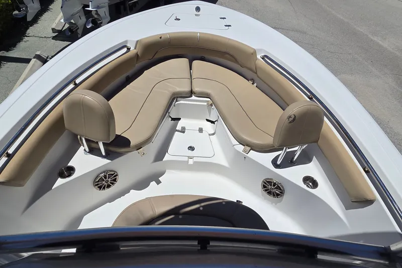Slide: The Image of 2016 Sportsman Heritage 211 Center Console boat with tan seating and stainless steel accents. - 13