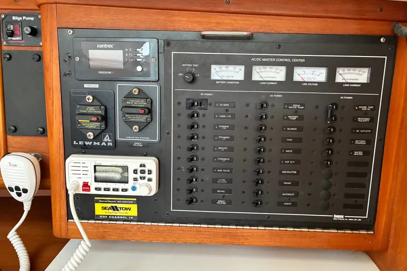 Slide: The Image of Control panel of a 1996 Freedom 35 sailboat with various switches and gauges. - 19