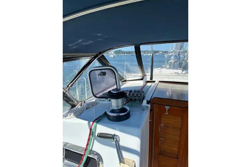 Slide: The Image of Interior view of a 1996 Freedom 35 sailboat cockpit with winch and ropes. - 29